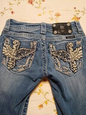 Embellished Blue Women's Jeans with Wing Pocket Detail. 23 Waist By 31 Boot Cut
